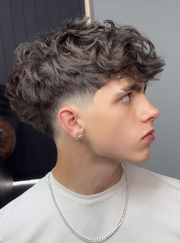 A clean drop fade with a textured wavy top