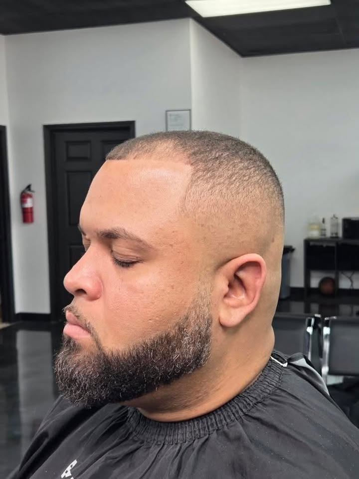 A bald fade with a full beard at Authentic Cutz