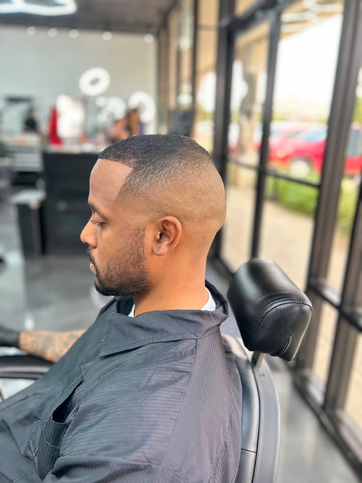 A clean sharp skin fade with a defined part