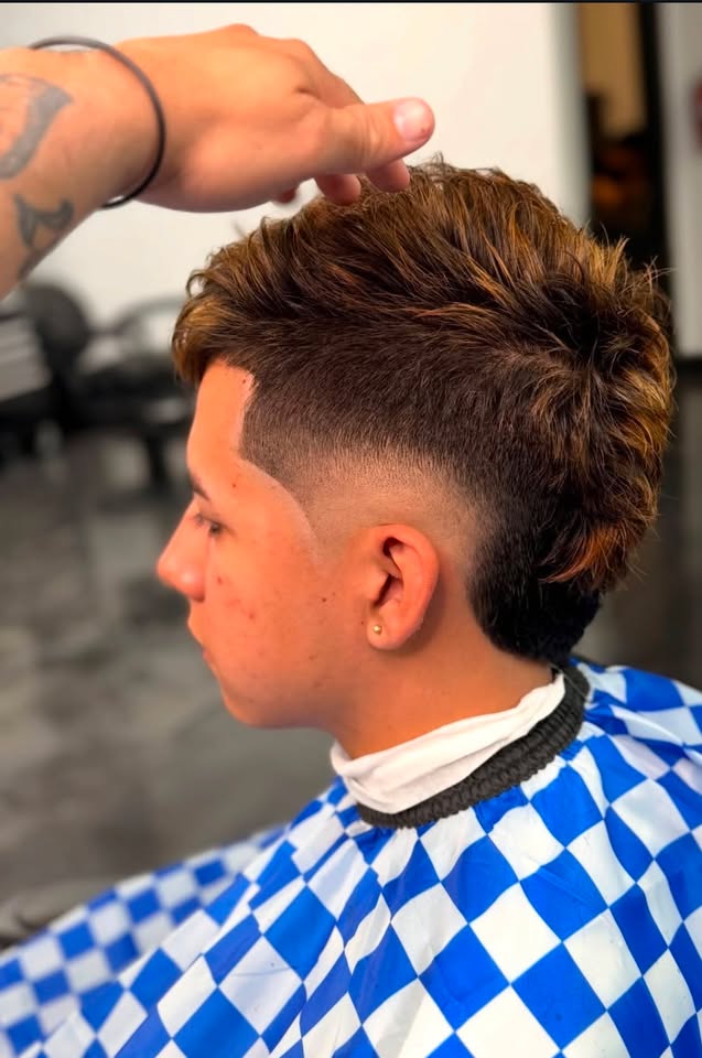 A textured mullet fade with color
