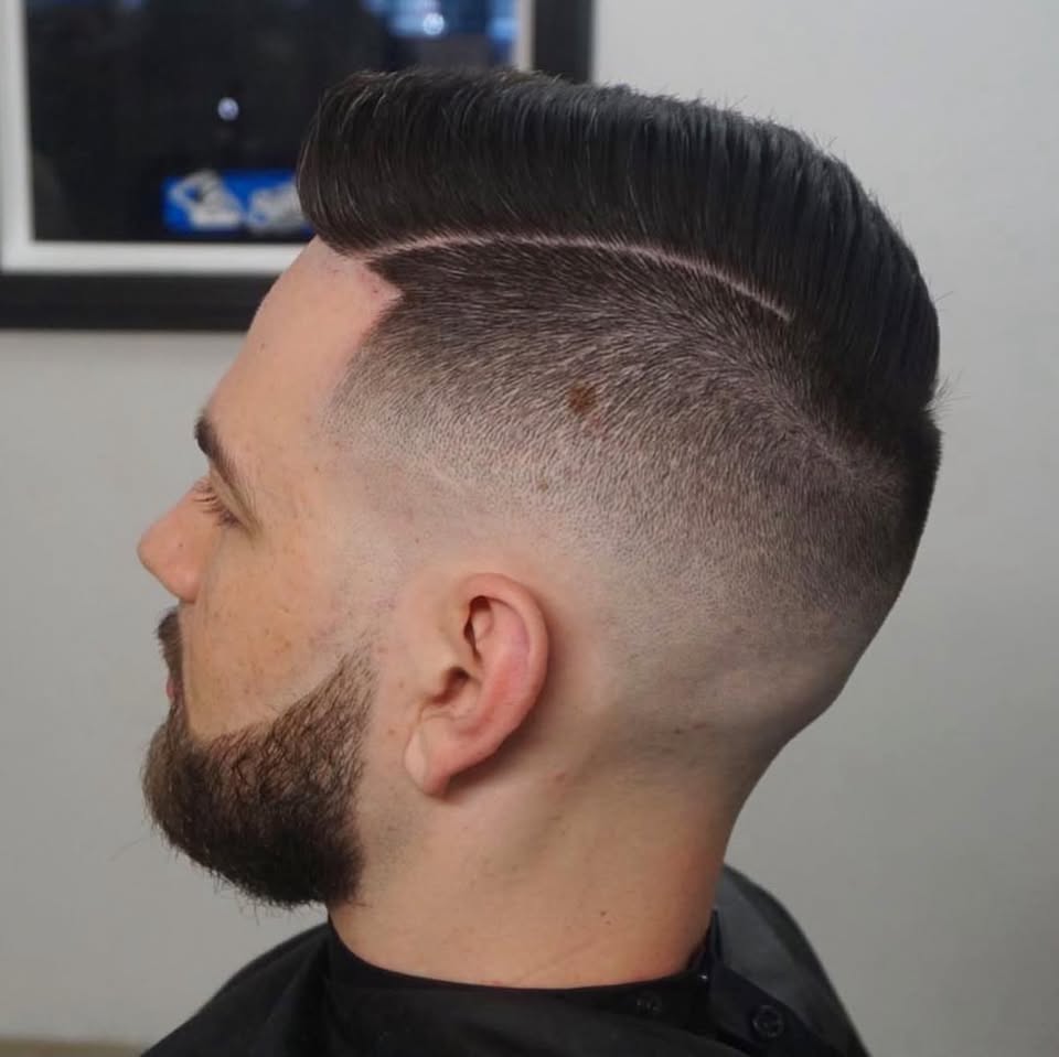 A sharp side part with a clean fade