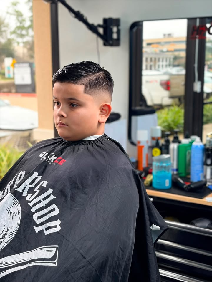 A young client with a clean fade at Authentic Cutz
